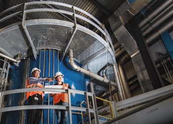 Scientists stand within the FRIB facility 