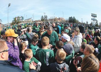 Coach Mark Dantonio signs autographs for fans