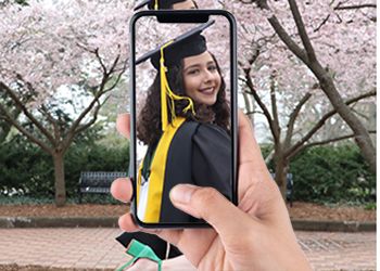 Lyman Briggs College graduate Joanna Colovas in graduation gown