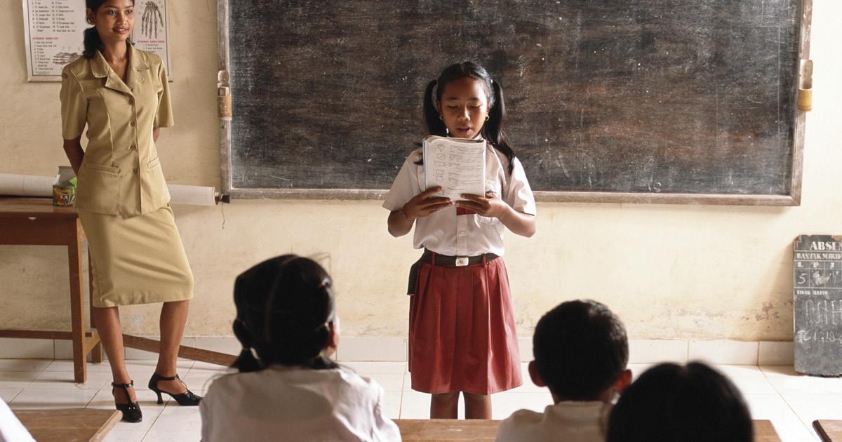 Indonesian primary school student and teacher