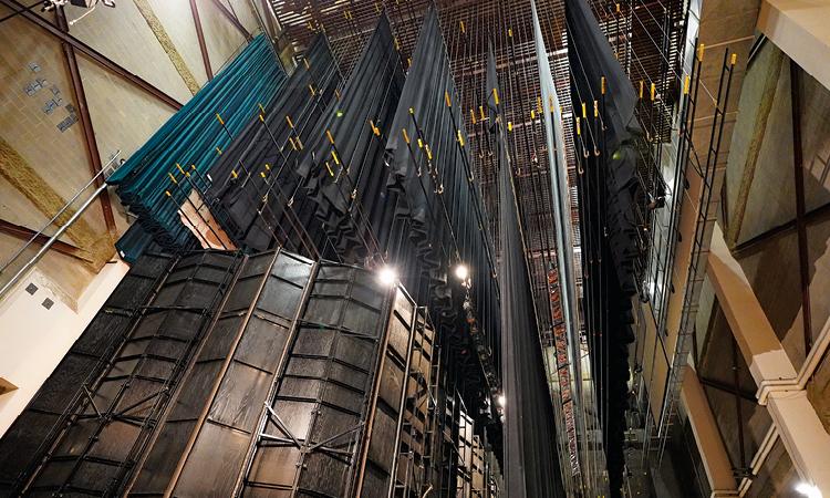 Looking up at the extensive and elaborate rigging operation in Cobb Great Hall.